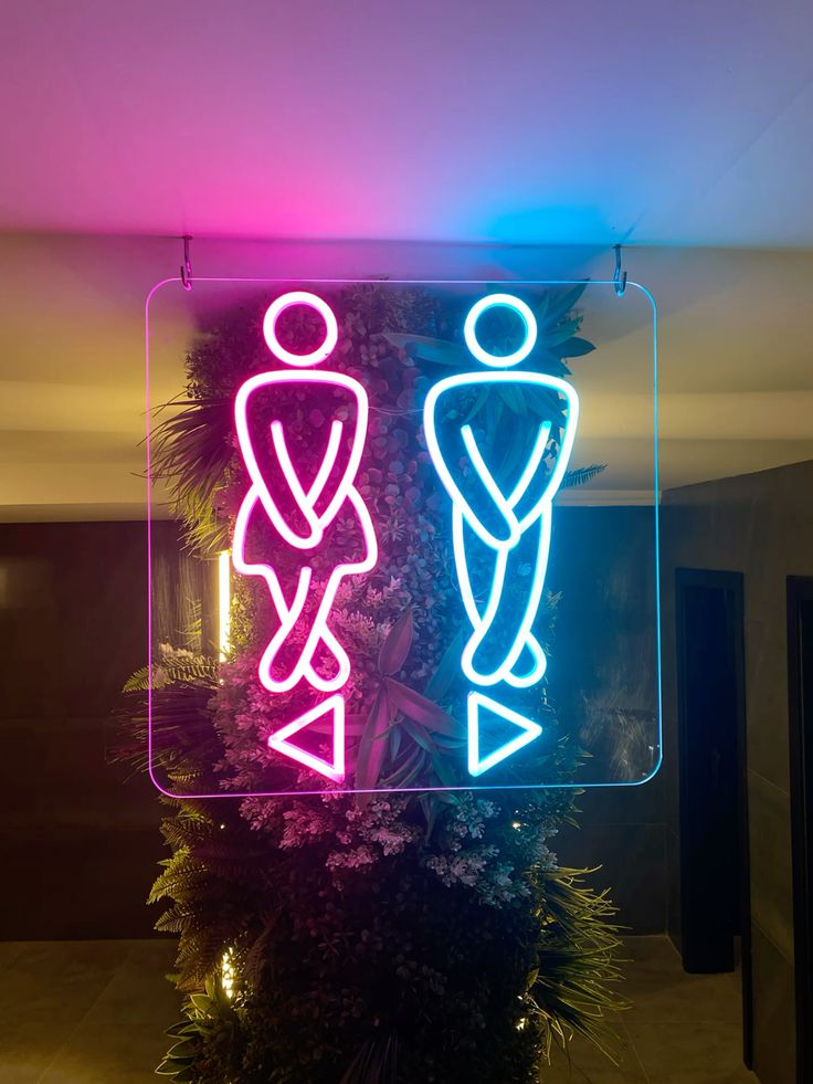 Vibrant Pink Blue Restroom Guide Neon Sign